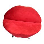 A stylish contemporary red upholstered sofa modelled as a pair of lips, on chrome supports, width
