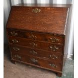 A Georgian oak bureau, the fall front enclosing a fitted interior above four long drawers on bracket