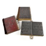 Three Victorian photograph albums containing portrait sepia photographs, some annotated (one album