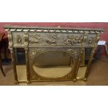 A Regency giltwood overmantel mirror with classical decorated frieze, central oval bevelled plate