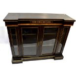 A late Victorian ebonised and inlaid invert breakfront credenza of small proportions, with twin