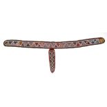 An original fragment of bead decorated Native American fabric, appearing to be a belt with a knife