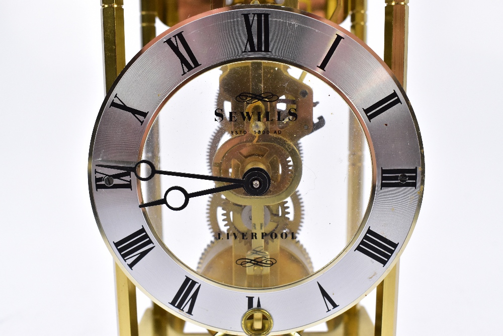 SEWILLS OF LIVERPOOL; a modern brass skeleton mantel clock, the applied silver coloured plastic dial - Image 2 of 5