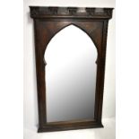 A good late 19th Century Gothic revival oak framed architectural wall mirror, with carved detail