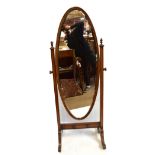An early 20th century walnut cheval mirror with oval bevelled plate, height 173cm, dimensions of