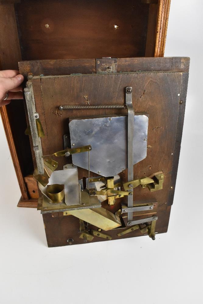 An early 20th century oak cased allwin machine, complete with two keys, height 65cm, width 45cm. - Image 2 of 2