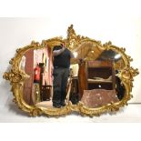A large decorative Rococo-style gilt mirror, 120 x 176cm.Additional InformationLight general wear.