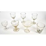 A collection of 19th century and later glassware including three rummers each raised on single