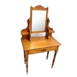 A Edwardian pine dressing table with mirror back above frieze drawer on turned supports, width