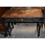 A late Victorian oak hall table, the rectangular top above a single frieze drawer with lion mask