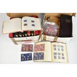 A large collection of stamps and coins in various albums, both full and partially full, also a large