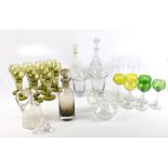 A group of glassware including a set of ten German Hock green wine glasses, cut clear and coloured