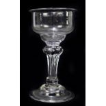 A Georgian sweetmeat glass, raised on fluted stem terminating on folded foot, height 14.5cm.