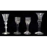 Four late 18th century wine glasses to include an example with bell shaped bowl, raised on double