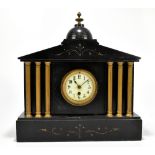 A Victorian slate mantel clock of architectural form, the central enamelled dial set with Arabic