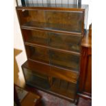 MINTY; a mahogany four section bookcase with sliding glazed doors, length 89cm, height 136cm.