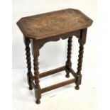 An early 20th century carved oak side table on barleytwist supports, height 75cm, length 57cm, depth