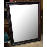 A modern rectangular wall mirror with bevelled plate, 140 x 108cm.Additional InformationSome rubbing