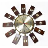 SMITHS; a 1960s/70s battery operated sunburst/starbust-type wall clock, the circular silvered dial