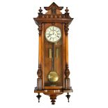 A Victorian walnut two weight Vienna clock.Additional InformationMissing lower right pendant.