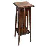 A small Arts & Crafts oak two tier jardinière stand, width 28cm, depth 28cm, height 79cm.