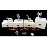 SWAROVSKI; eight crystal figures including various floral examples, giraffe, heron, etc, each in