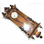 A late 19th century walnut cased Vienna style wall clock with chain driven movement, a circular dial