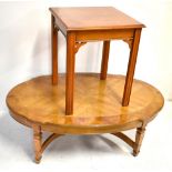 A reproduction elm and oak veneered oval coffee table, length 121cm, and a reproduction yew wood