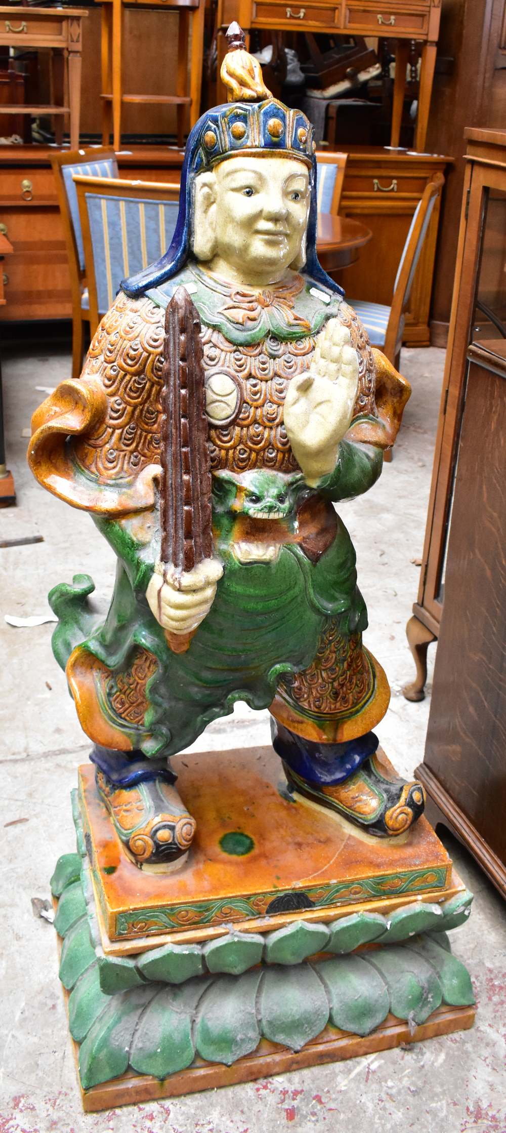 A reproduction sancai glazed figure of a Tibetan deity, raised on plinth base, height 134cm.