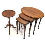 A nest of three oval occasional tables on cabriole supports, and a mahogany tripod table (2).