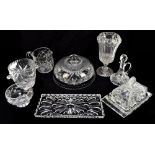 A group of clear glass tableware including decanters, one with silver sherry decanter label,