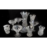 A group of glass including a set of twelve wine glasses with green bowls, clear cut glass and