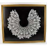 A Victorian lace work dress collar with floral motif, framed and glazed, frame 69 x 79cm.