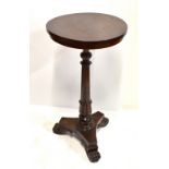 A William IV mahogany circular tripod table on fluted column supports, height 73cm, diameter 39cm.