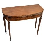 A 19th century mahogany tea table with foldover top on turned supports, height 71cm, width 91cm,