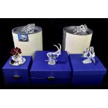 SWAROVSKI; five crystal figures, including vase and roses, seals, etc, each in outer box (5).