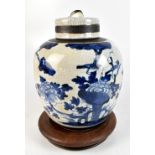 A late 19th century Chinese earthenware crackle glazed lidded ginger jar decorated in underglaze