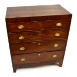 A George IV mahogany and ebony strung chest of four long drawers on bracket feet, width 63.5cm,