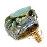 A Chinese pottery wall pocket decorated with a crab, unmarked, height 13cm, width 14.5cm.