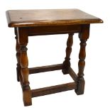 An oak joint type stool with rectangular top on turned stretchered supports, 46 x 30cm.