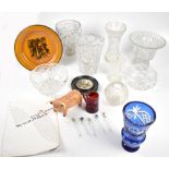 A group of cut glass tableware including a blue vase, a cranberry glass mug inscribed 'Forget Me