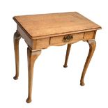 An early 20th century oak single drawer side table on cabriole supports, height 77cm, length 76cm.