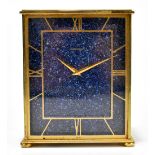 JAEGER-LE-COULTRE; an eight day brass cased mantel clock, the rectangular dial set with Roman