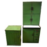 A vintage green painted kitchenette cabinet, a green painted pine cupboard with panelled door,