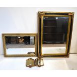 A black and gilt framed rectangular bevelled wall mirror, 111 x 82cm, a smaller gilt framed bevelled