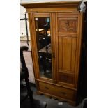 An Edwardian satin walnut mirror door wardrobe, with drawer to base, width 103cm.Additional
