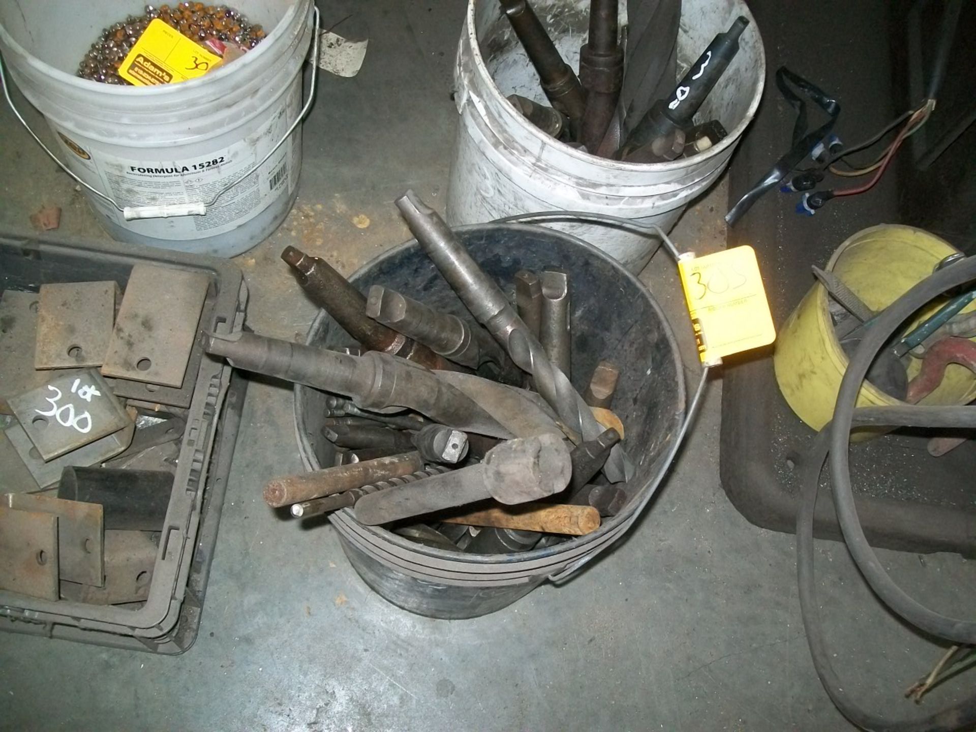 BUCKET OF LARGE DRILL BITS