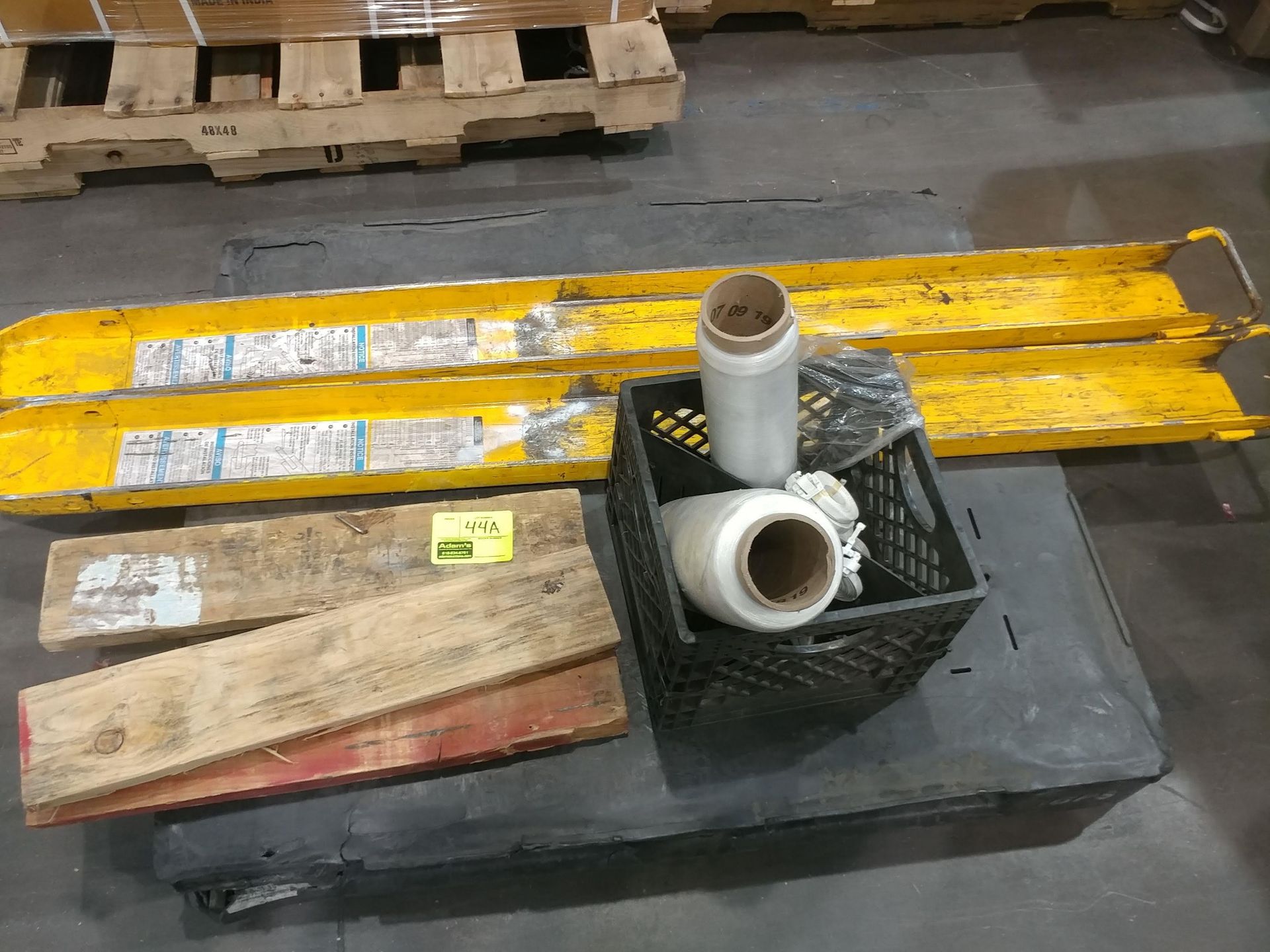 (2) Forklift prongs, pallet netting, wood, misc