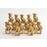 13 BUDDHIST GUARDIAN LION FORM GILT NAPKIN RINGS