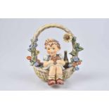 GOEBEL / HUMMEL Figur 'Der Geschenkkorb - A Basket of Gifts', Porzellan, polychrome Bemalung,